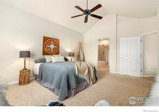 carpeted bedroom with ceiling fan, high vaulted ceiling, and ensuite bathroom