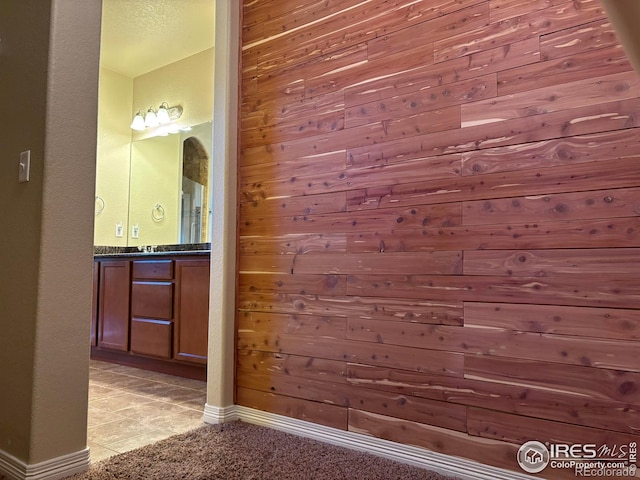 interior space featuring wooden walls