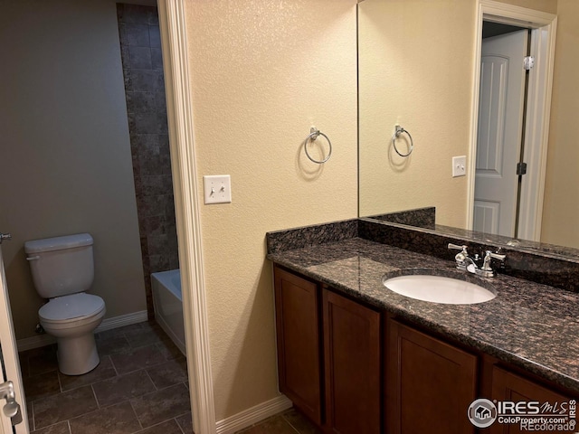 bathroom featuring vanity, toilet, and tile patterned floors