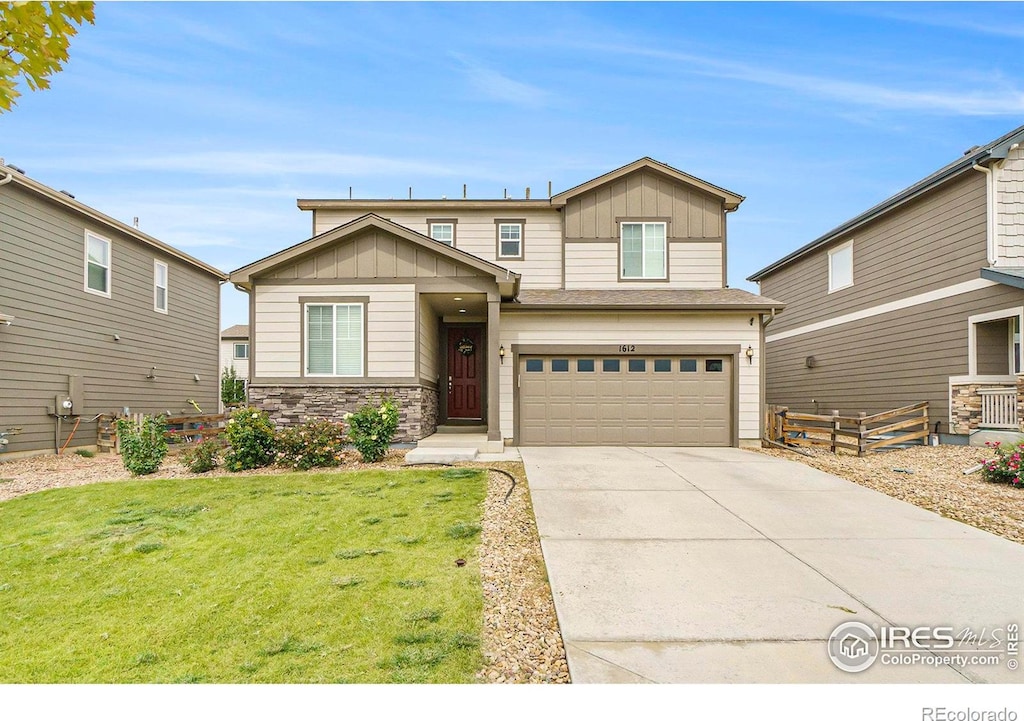 craftsman-style home with a garage and a front lawn