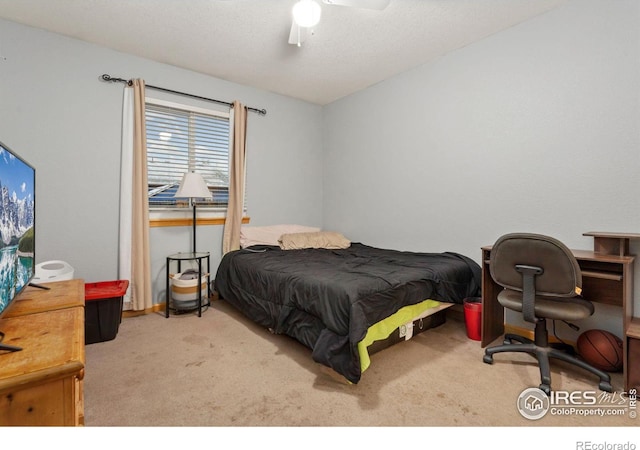 bedroom with ceiling fan and light colored carpet