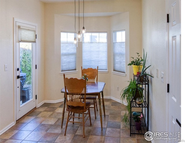 dining area featuring a chandelier