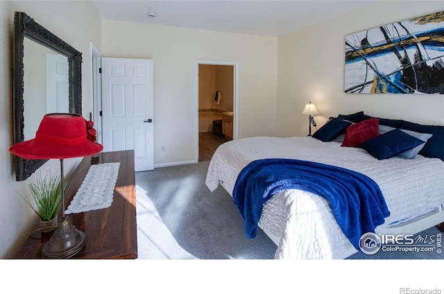 carpeted bedroom featuring connected bathroom