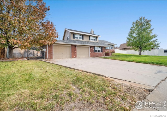 view of front of home with a front yard and a garage