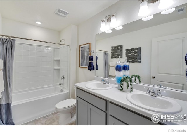 full bathroom with shower / bath combo, vanity, toilet, and tile patterned floors