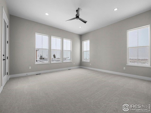 empty room with recessed lighting, light colored carpet, baseboards, and ceiling fan