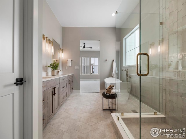 bathroom with ceiling fan, tile patterned floors, vanity, and plus walk in shower