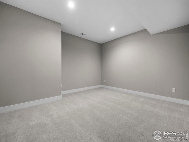 empty room with light colored carpet