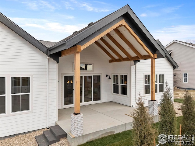 rear view of property featuring a patio area