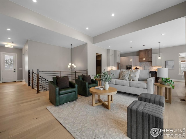 living room featuring recessed lighting and light wood-type flooring