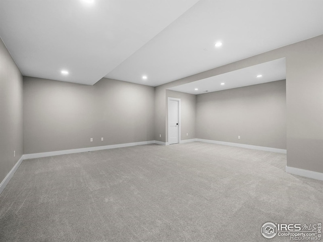 finished below grade area with recessed lighting, baseboards, and carpet floors