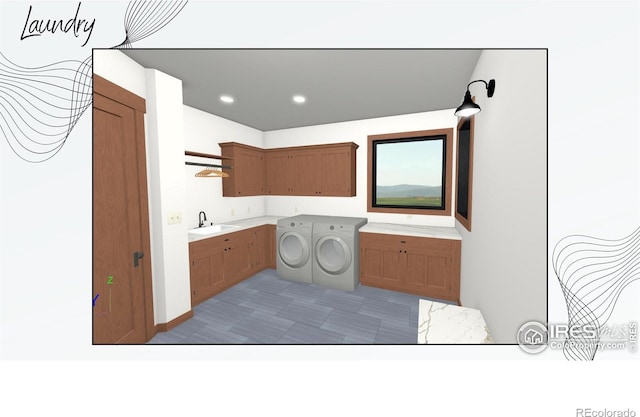 laundry room featuring cabinets, sink, and washing machine and clothes dryer