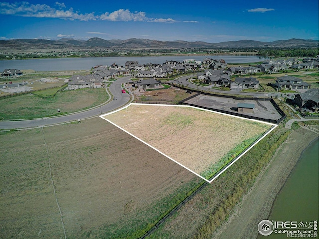 bird's eye view featuring a water and mountain view