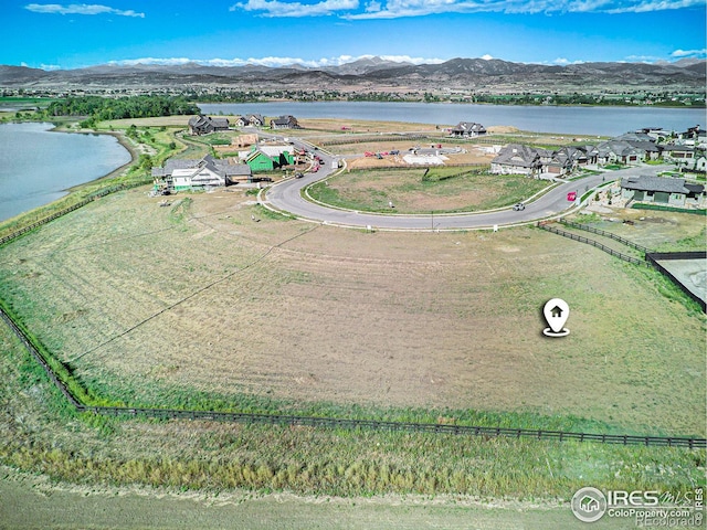 bird's eye view featuring a water and mountain view