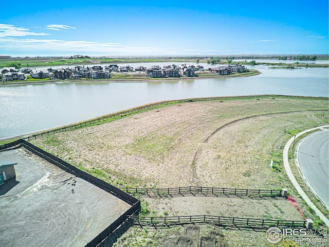 bird's eye view with a water view and a rural view