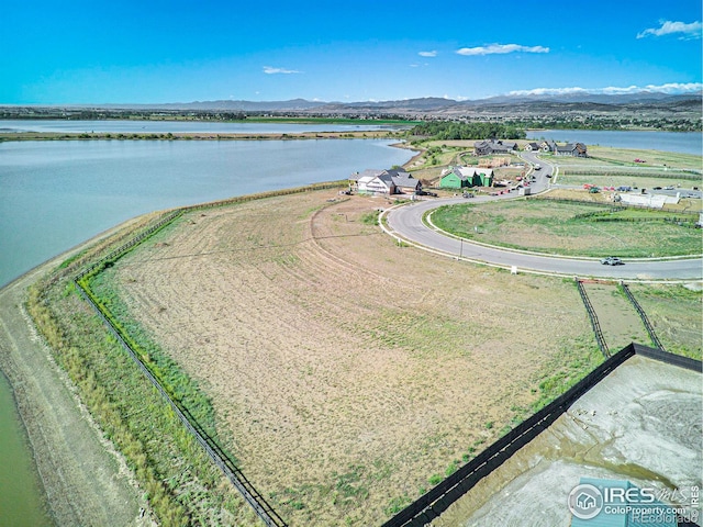 bird's eye view featuring a water and mountain view