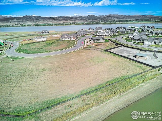 bird's eye view featuring a water and mountain view