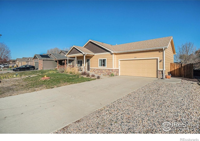 view of front of house with a front yard and a garage