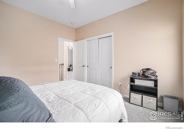 bedroom with carpet, a closet, and ceiling fan