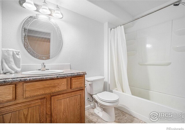 full bathroom with tile patterned floors, vanity, toilet, and shower / bathtub combination with curtain