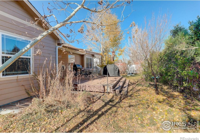 view of yard with a deck