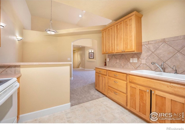 kitchen featuring backsplash, sink, white electric range, hanging light fixtures, and lofted ceiling