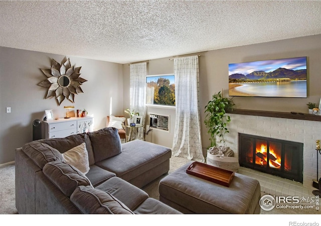 living room with a fireplace, light carpet, a textured ceiling, and an AC wall unit