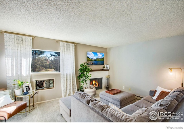 living room with a textured ceiling, light colored carpet, and a baseboard heating unit