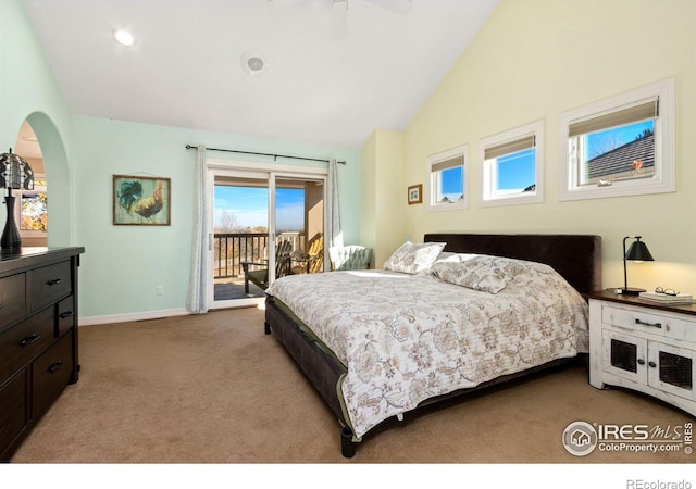 bedroom featuring ceiling fan, light colored carpet, access to outside, and vaulted ceiling