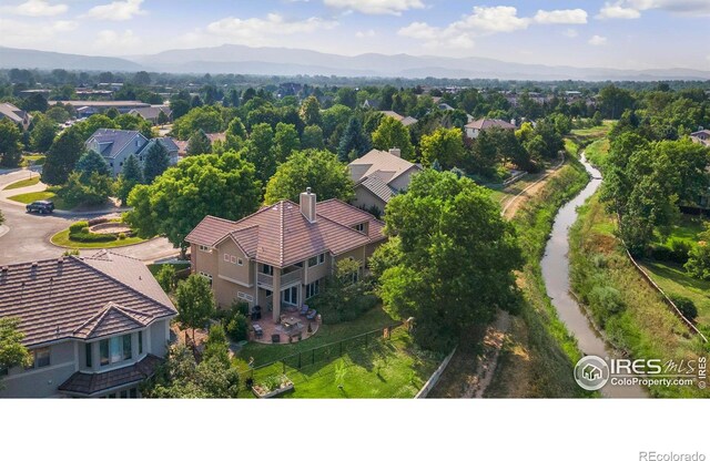 birds eye view of property featuring a mountain view