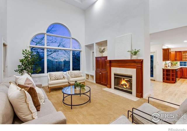 378 High Pointe Dr, Fort Collins, CO 80525 - living room featuring a towering ceiling and a high end fireplace