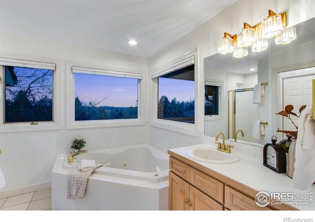 378 High Pointe Dr, Fort Collins, CO 80525 - full bathroom featuring a stall shower, a whirlpool tub, vanity, and tile patterned flooring