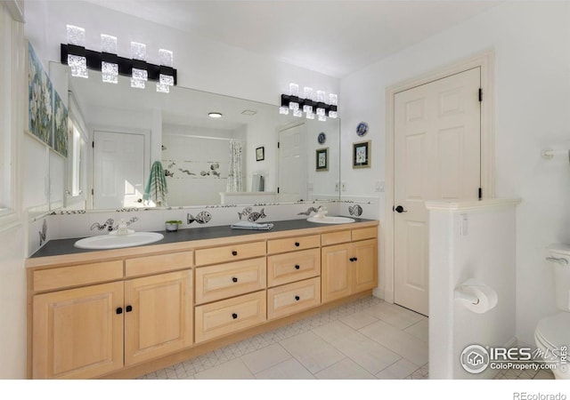 378 High Pointe Dr, Fort Collins, CO 80525 - bathroom with a shower stall, tile patterned flooring, double vanity, and toilet