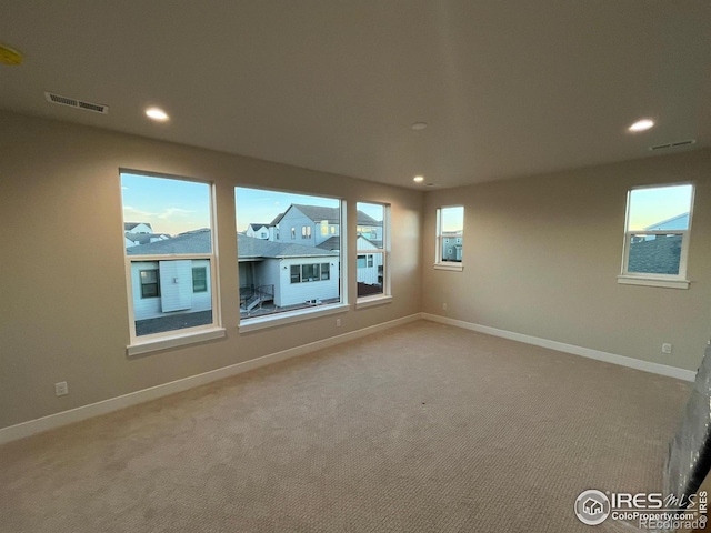 empty room featuring light colored carpet