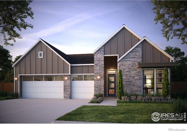 view of front of property featuring a lawn and a garage