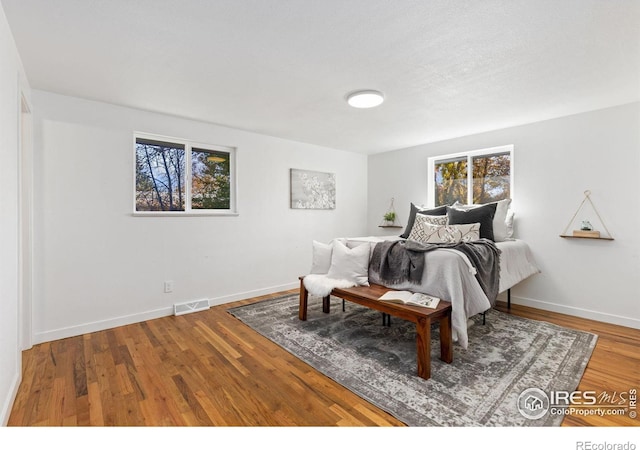 bedroom featuring hardwood / wood-style flooring