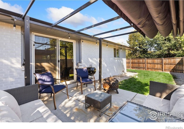 view of patio / terrace with an outdoor living space with a fire pit