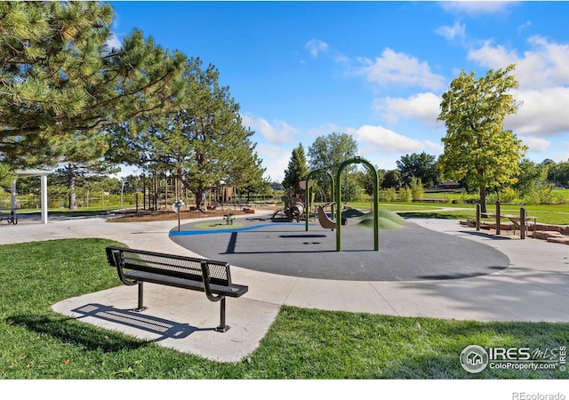 view of home's community featuring a playground and a lawn