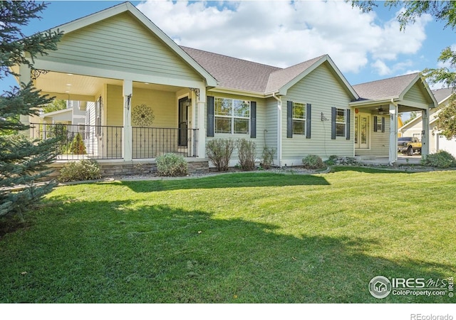 view of front of home with a porch and a front yard