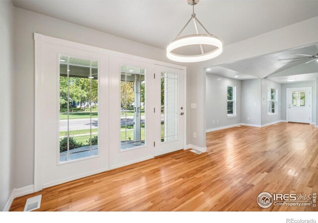 interior space featuring light hardwood / wood-style floors and ceiling fan