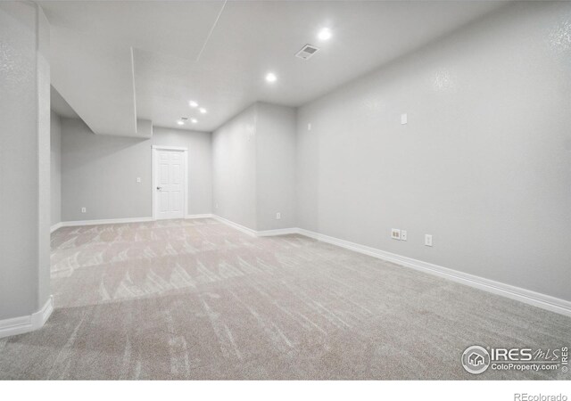 basement with light colored carpet