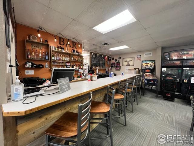 bar with a paneled ceiling