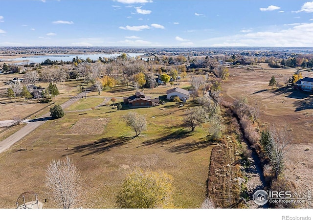 bird's eye view featuring a water view and a rural view