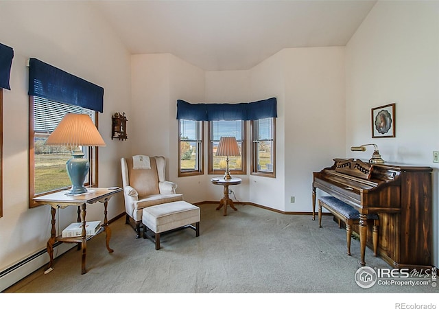 sitting room with carpet flooring and a baseboard radiator