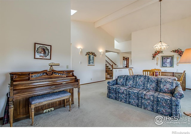 carpeted living room featuring beamed ceiling, high vaulted ceiling, and a chandelier