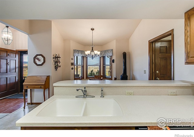 bathroom with sink and an inviting chandelier