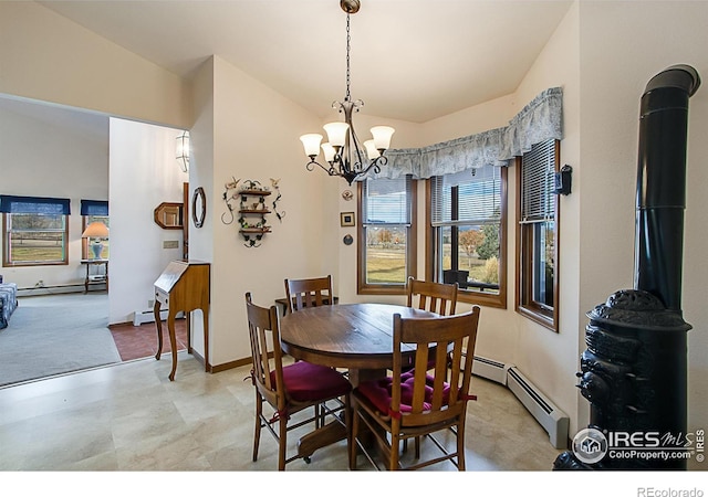 carpeted dining space featuring a chandelier, a baseboard heating unit, and vaulted ceiling