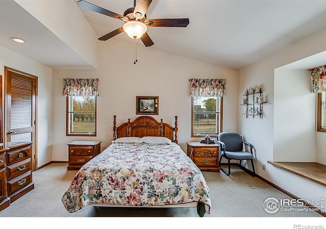 carpeted bedroom featuring ceiling fan and lofted ceiling