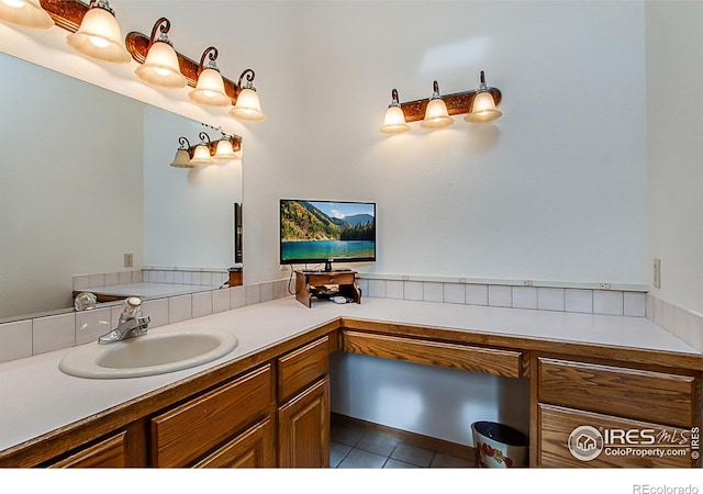 bathroom featuring tile patterned flooring and vanity