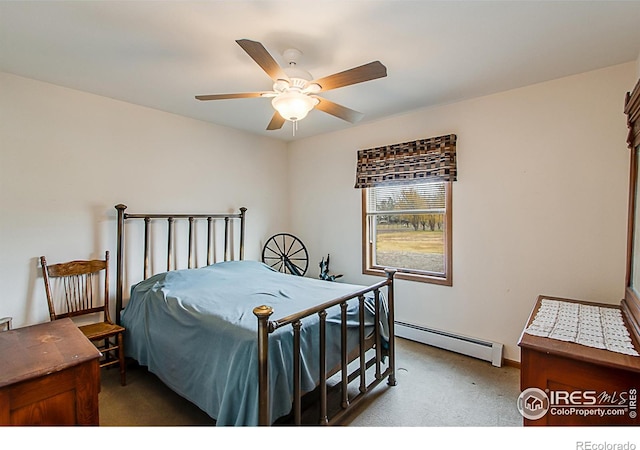 bedroom with ceiling fan, carpet floors, and a baseboard heating unit